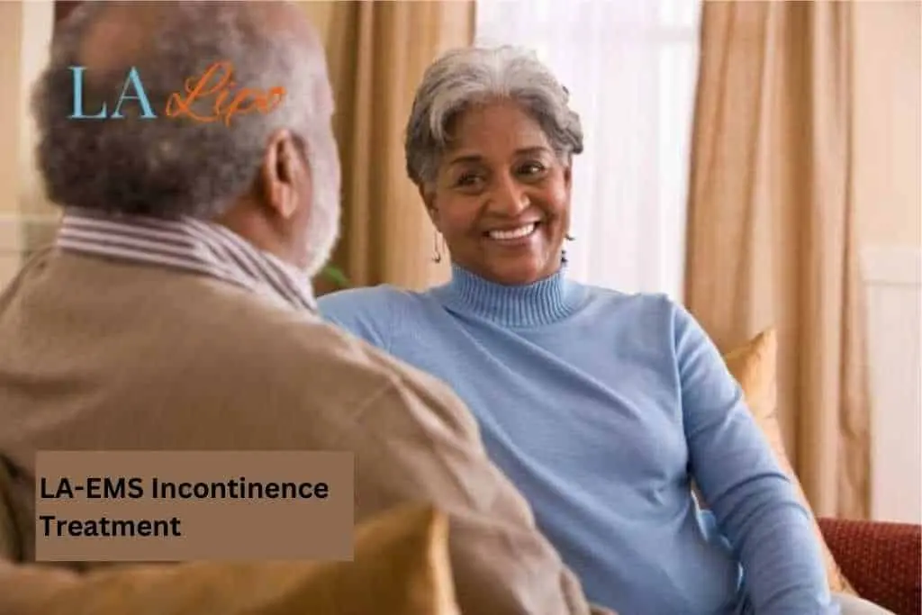 Couple sat smiling at each other - LA-EMS treatment Little Bognor