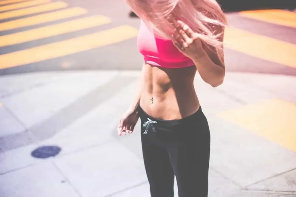Woman with toned stomach after LA-EMS Body Sculpting Treatment Little Bognor